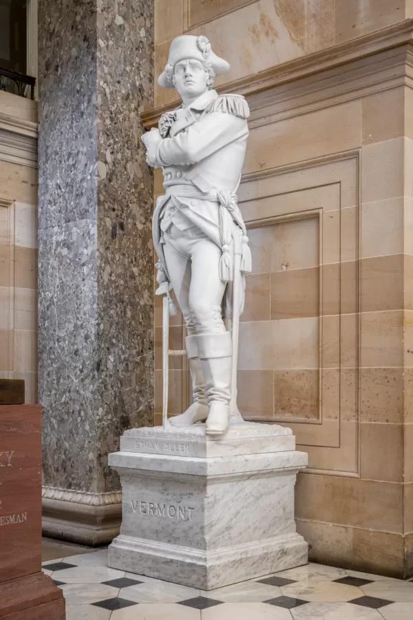 Marble statue of a person standing.