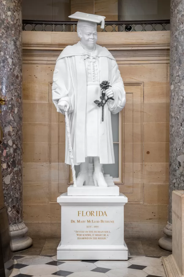 Marble statue of a person standing.