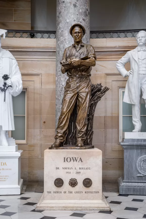 Bronze statue of a person standing.