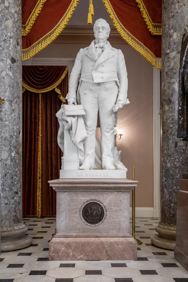 Marble statue of a person standing.