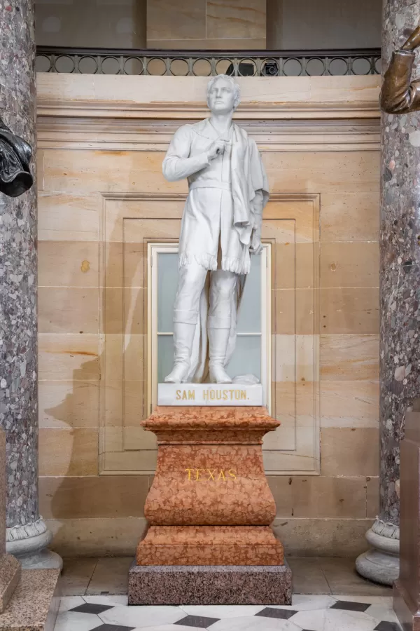 Marble statue of a person standing.