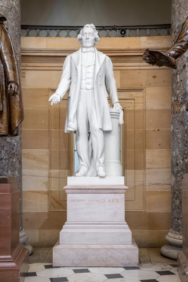 Marble statue of a person standing.