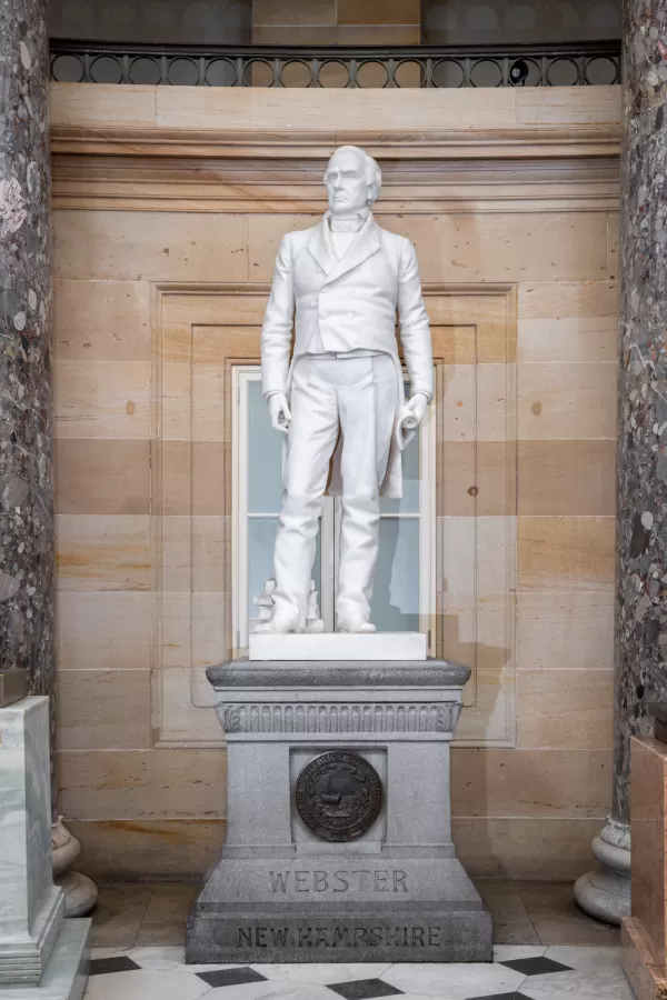 Marble statue of a person standing.