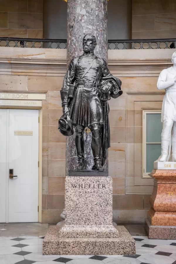 Bronze statue of a person standing.