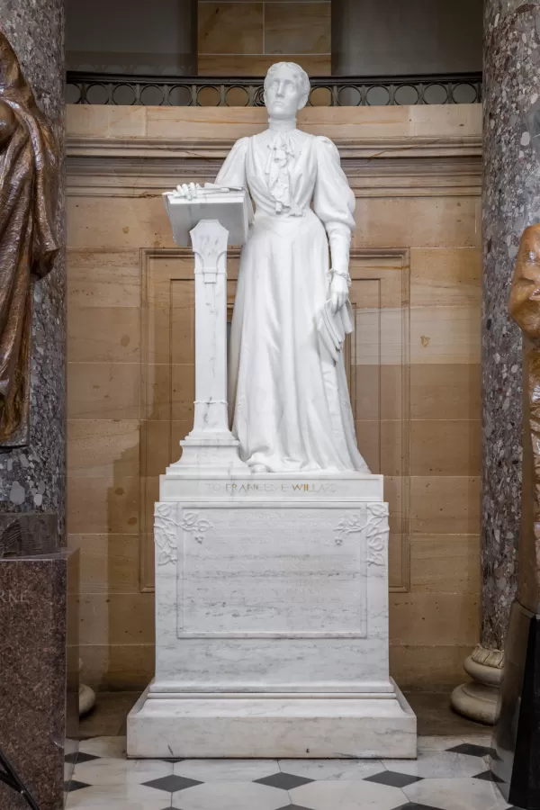Marble statue of a person standing.