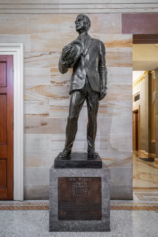 Bronze statue of a person standing.