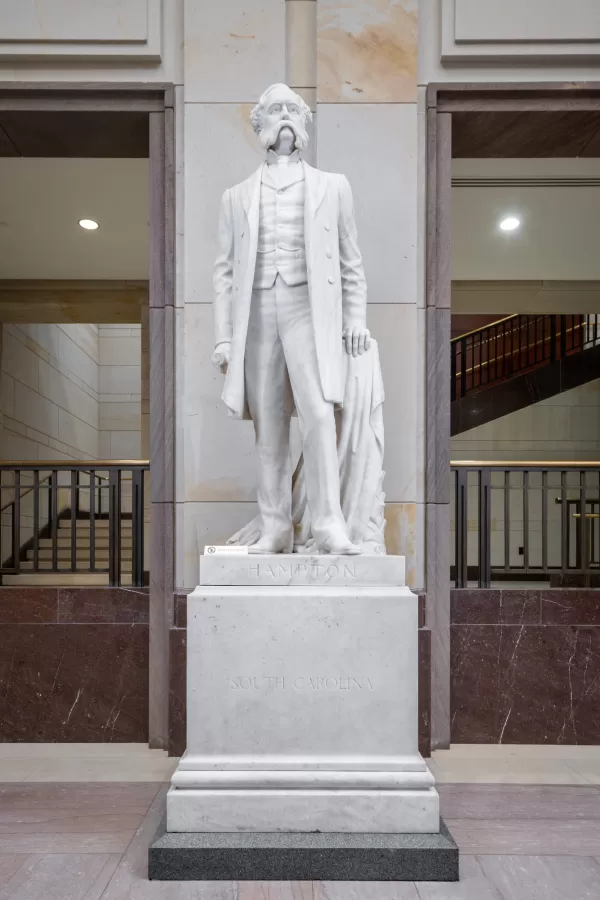 Marble statue of a person standing.